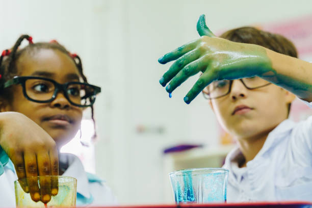 istock Children conducting a scientific experiment in the school laboratory 2158326918