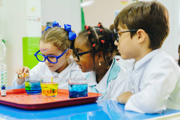 istock Children conducting a scientific experiment in the school laboratory 2158327290