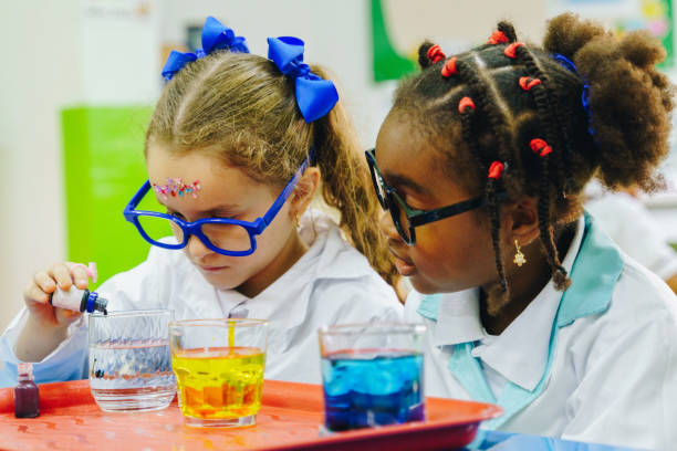 istock Children conducting a scientific experiment in the school laboratory 2158327425