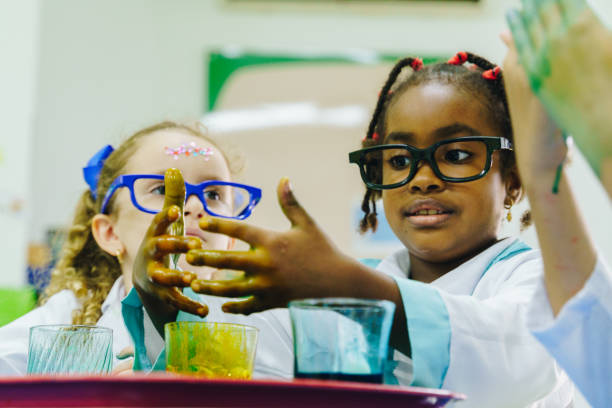 istock Children conducting a scientific experiment in the school laboratory 2158327447