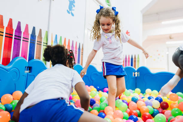 istock Children playing on ball pool in the school playroom 2158327464
