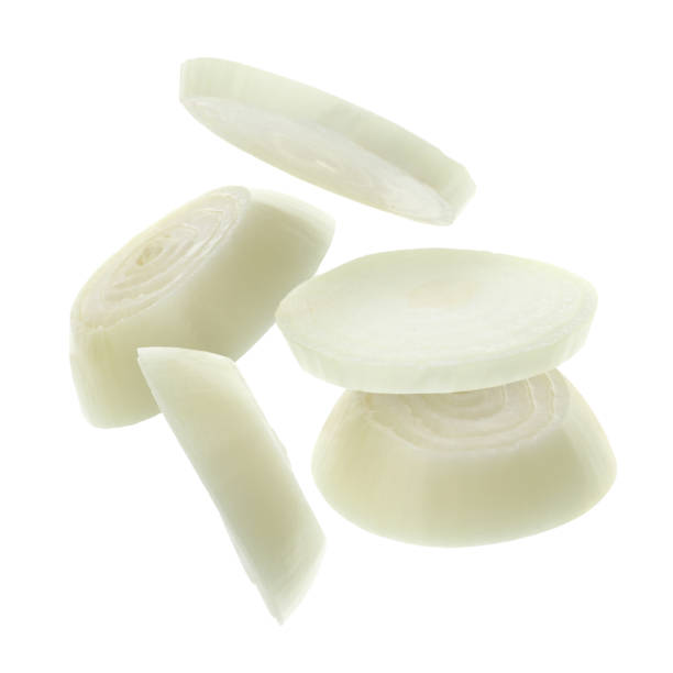 istock Fresh onion slices falling on white background 2158327494