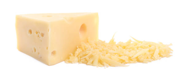 istock Grated and whole piece of cheese isolated on white 2158327555