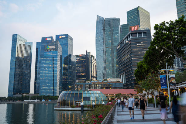 Singapore, Singapore - April 3, 2024. Tourists walking at Marina Bay Waterfront Promenade, Singapore
