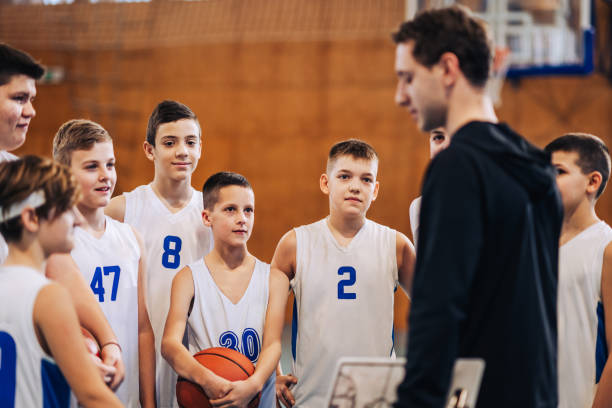 Focused basketball players during a team discussion