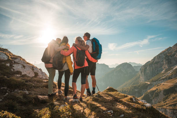 istock Diverse Friends Embracing and Laughing in Julian Alps 2158336516