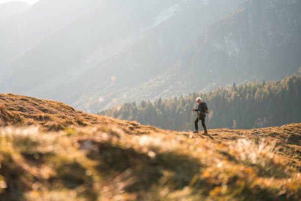 istock Senior Man Trekking in Mountain Landscape 2158336549