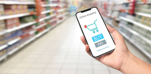 istock Hand holding new smartphone . Smartphone 2158337737