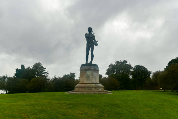 Old Bronze Statue in a Public Park of a Young Musician Playing a Violin