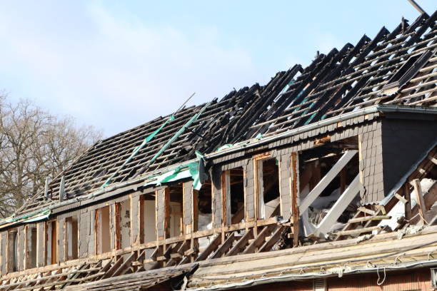 istock A building is being partially demolished under a clear blue sky, revealing its structural framework 2158347498