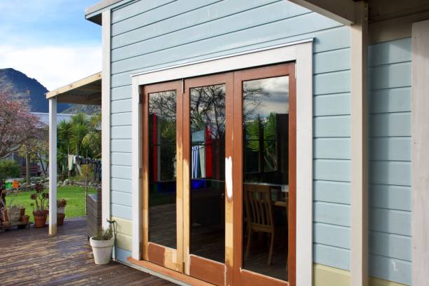 istock Bifold Wood Doors and New Clapboard Cladding in Renovation Stage 2158349448