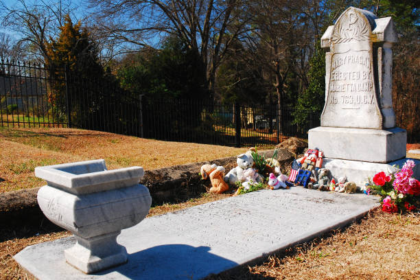 Marietta, GA, USA February 28,  Toys, stuffed animals and other gifts are laid around the grave of Mary Phagan, a girl killed under mysterious circumstances