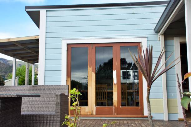 istock Bifold Wood Doors and New Clapboard Cladding in Renovation Stage 2158354084