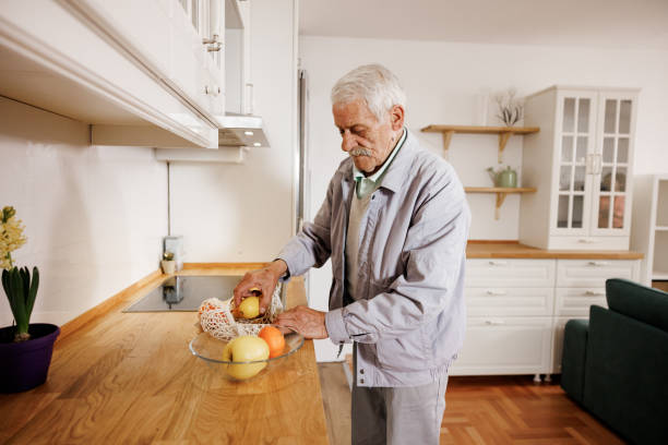 istock Senior man returns home after shopping 2158357192