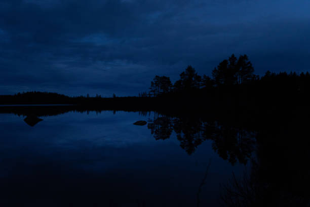 istock A beautiful evening scenery ot the forest lake in Sweden. 2158357893