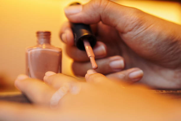 Woman manicuring her nails, Close-up