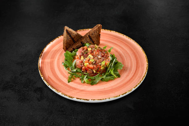 istock Tuna Tartare with Avocado and Toast Points on Elegant Plate 2158358682