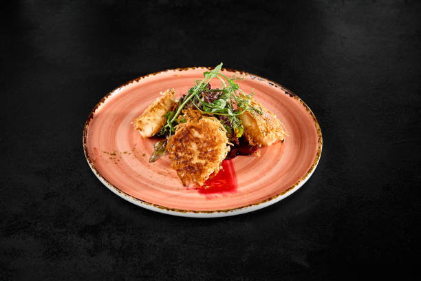 istock Tempura Fried Cheese with Beetroot and Greens on Rustic Plate Against Dark Background 2158358684