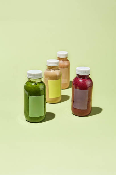 istock Colorful Detox Juice Bottles in Minimalist Concept Pattern - Fresh Vegetable and Fruit Drinks Cleanse Program 2158358884