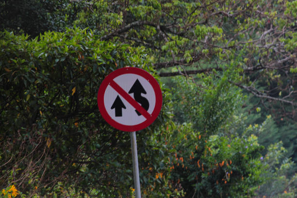 Corner road sign, black, white and red