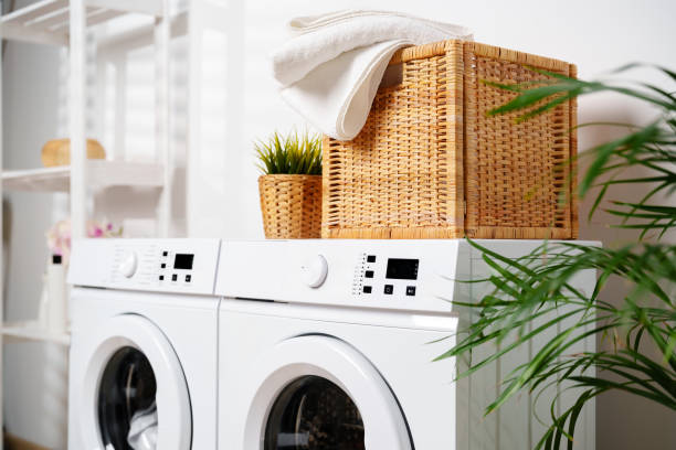 istock White Towels In Wicker Basket On Top Of White Washing Machine 2158360174