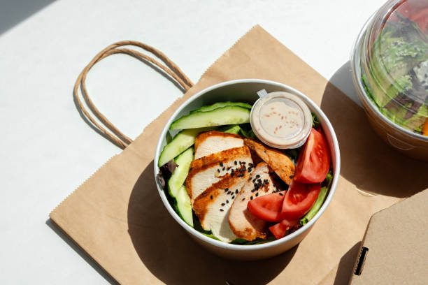istock Take out poke bowl with craft bag on white background 2158362346
