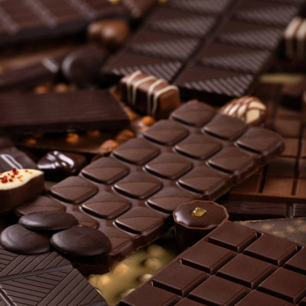 istock assorted chocolate bars and candy, delicious dessert food. sweet chocolate background 2158362559