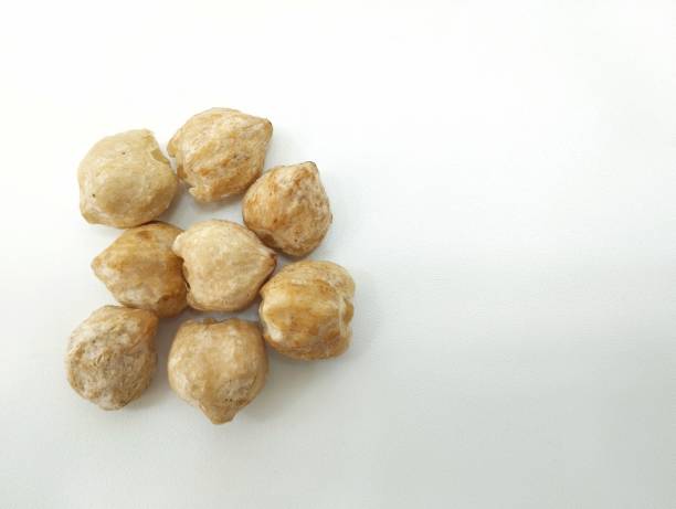 istock Aleurites moluccana Candlenut seeds isolated in white background 2158362857