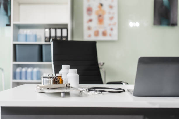 A clean desk with medical equipment, ready for professional use, sits empty, awaiting the next task or appointment.