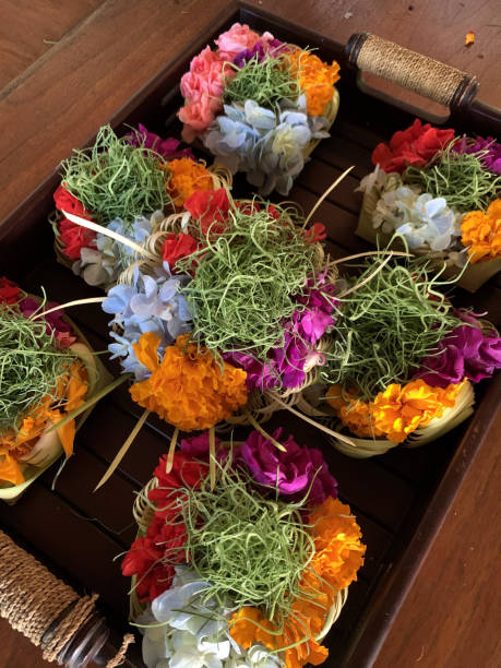 istock Hands Arranging Colorful Balinese Offerings 2158364384