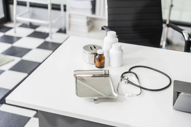 A clean desk with medical equipment, ready for professional use, sits empty, awaiting the next task or appointment.