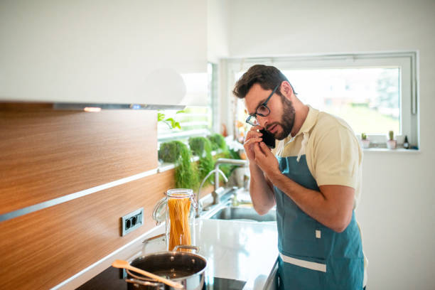 istock Hispanic Chef Prepares Fresh Produce in Home Kitchen 2158364572