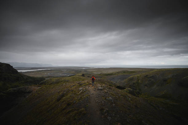 Man standing on the edge of a mountain