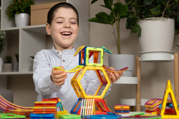 istock A child plays with a magnetic construction set. Interesting educational toys. 2158367186