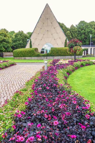 istock Flowering flower bed by a walkway to a chapel 2158368265