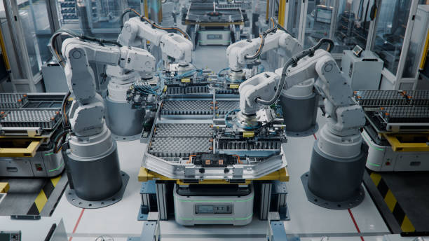 istock Lithium-Ion EV Battery Pack Assembly Process. Electric Car Manufacturing Inside Automotive Factory. Row of Industrial Robotic Arms at Automated Production Line at Bright Modern Factory. 2158369989