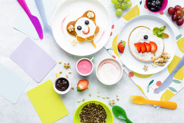 istock Cute breakfast background, kids pancakes and chocolate cereal 2158370091