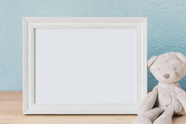 istock Kids room decoration, blank picture frame, plush bear toy 2158371306