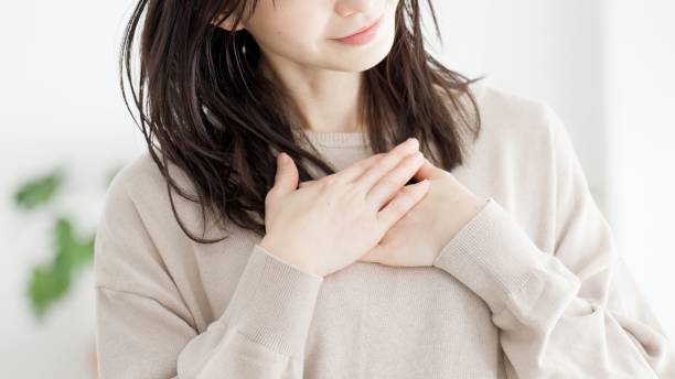 istock A woman who feels happy with her hands on her chest 2158372777