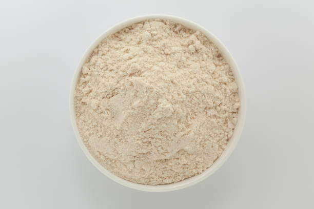 istock Organic Wheat Flour (Triticum), in a white ceramic bowl. Isolated on a gray background. Top View 2158374259