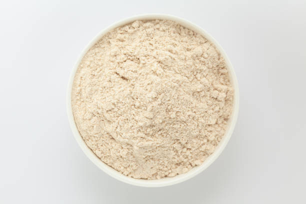 istock Organic Wheat Flour (Triticum), in a white ceramic bowl. Isolated on a gray background. Top View 2158374277