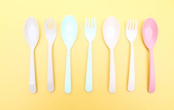 istock Utensils set colorful fork, chopstick and spoon isolated on yellow background 2158374416