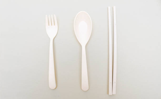 istock Utensils set colorful fork, chopstick and spoon isolated on gray background 2158374484