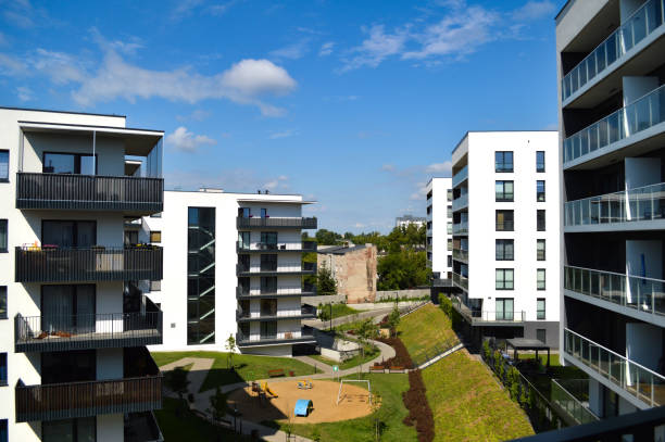 Modern Polish residential buildings stand tall, showcasing sleek architecture and contemporary design. These apartment blocks, available for purchase through credit, offer a perfect blend of style, comfort, and urban living.