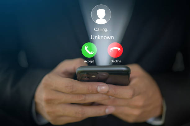 istock Human use smartphone with incoming call from unknown number, spam, prank caller, hoax person, fake identity, scammer, scam with mobile phone, hacker, call center, crime, call, fraud or phishing 2158378771