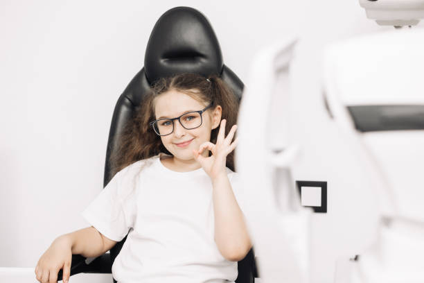 istock In a modern ophthalmology clinic, a small patient undergoes vision diagnostics. In the interior of a modern clinic. The concept of vision correction and diagnostics at an early age. 2158380768