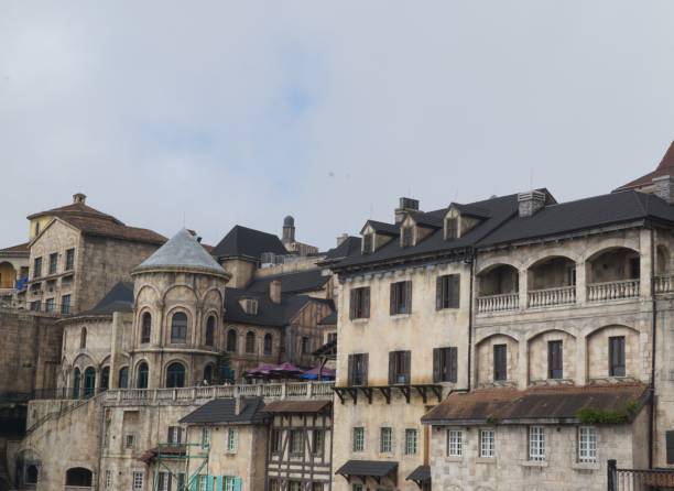 A row of old buildings with arched windows and balconies