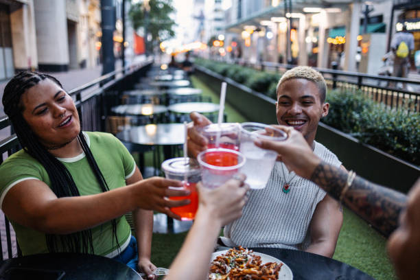 istock Group of friends toasting drinks at outdoor restaurant 2158383750