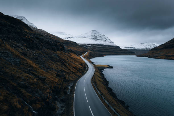 istock Scenic freeway by the lake on Faroe Islands 2158385880