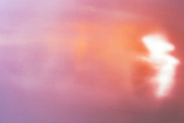 Defocused abstract orange purple background with white flare from sunlight, holiday backdrop, celebration wallpaper. Colorful sparkle sun glare, Glittering aesthetic textured photo, trend color